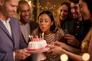 Woman,Blowing,Out,Candles,On,Birthday,Cake $1 B-Day Stay